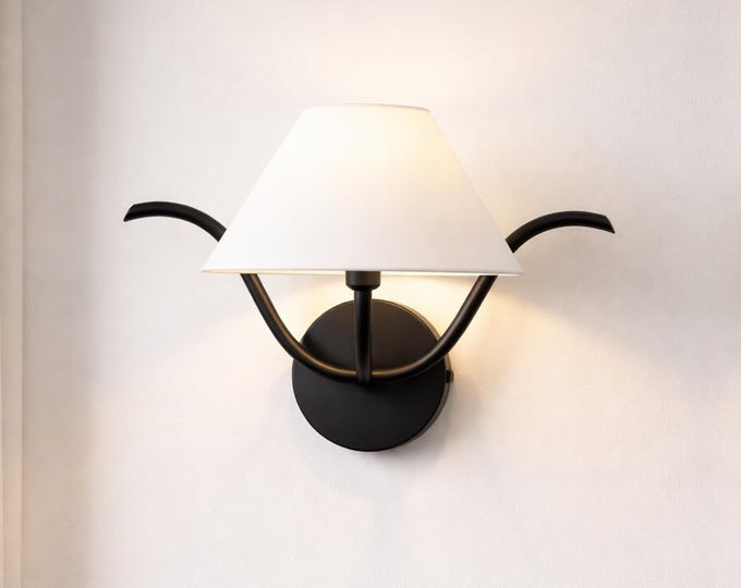 Elevate your interiors with the bold presence of matte black lighting.