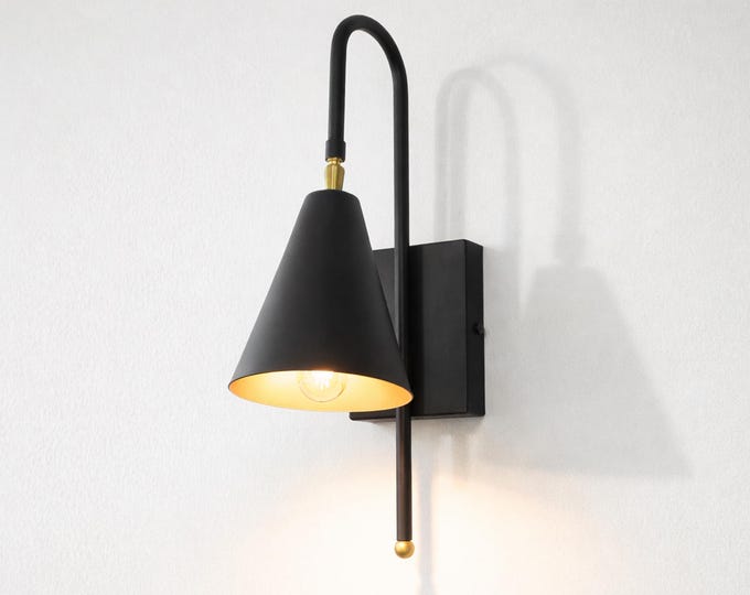 Immerse your space in the subtle glow of matte black artistry.