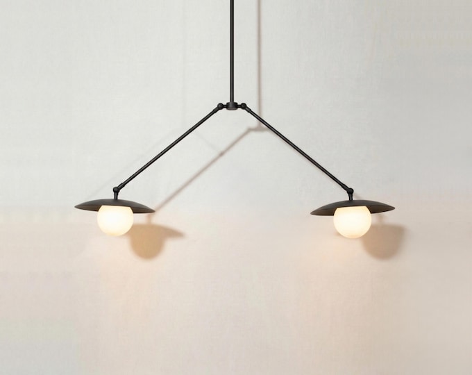 The Matte Black Chandelier Light redefines sophistication with bold contemporary charm.