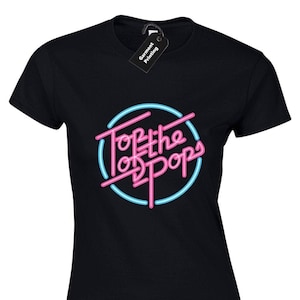 May include: Black t-shirt featuring a pink and blue neon sign graphic that reads "Top of the Pops".