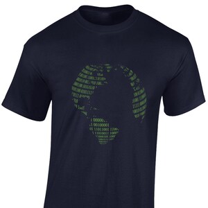 May include: A navy blue t-shirt featuring a green graphic of a globe made from binary code. The code includes the numbers 0, 1, and the letters I, J, K, L, and U.