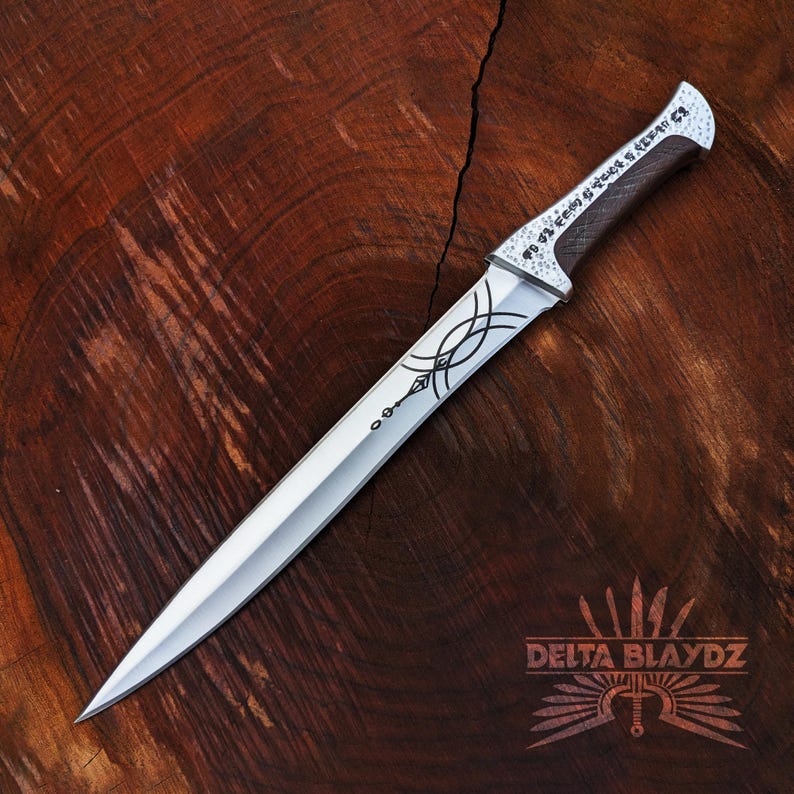 Handmade Paul Atreides Crysknife Replica: Dune Movie Carbon Steel Short Sword with Leather Sheath
Dune Knives: Movie Replica Handmade Knives | Gift for Men | Birthday Gift | Free Sheath | Movie Props | Christmas Gift | Dune 2024 Knife | Personalized Knife | Gift for Him | Anniversary Gift | Wedding Gift | Outdoor Knife | Hunting Knife | Groomsmen Gift Knife | Best Men Gift