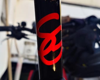 Her initials as a reflective sticker on her bike