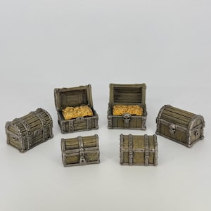 May include: Miniature wooden treasure chests, some open to reveal gold coins. The chests are weathered with metal accents and skull details. A set of fantasy-themed decorative items.