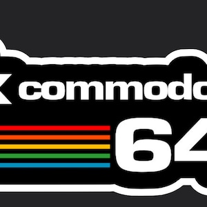 May include: A black and white logo for the Commodore 64 computer. The logo features the text "Commodore" and "64" in white, with a rainbow stripe design below the text.
