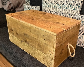 Rustic storage box with rope handles.