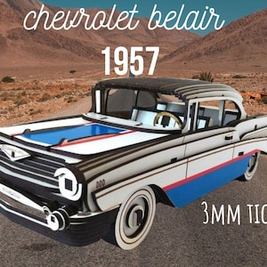 May include: A white, black, and blue 1957 Chevrolet Bel Air model car made of wood. The car is 3mm thick and has a detailed design.