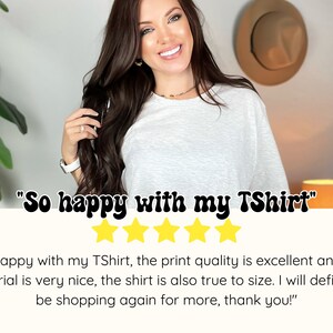 May include: A woman wearing a white t-shirt with the text "So happy with my TShirt" and five yellow stars below it. The text "So happy with my TShirt, the print quality is excellent and the material is very nice, the shirt is also true to size. I will definitely be shopping again for more, thank you!" is below the stars.