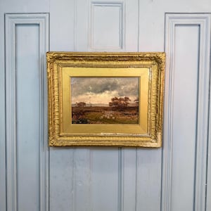 Antique landscape oil painting with shepherd and sheep at sunset