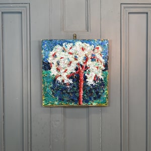 May include: A painting of a tree with white blossoms and a red trunk against a blue and green background.