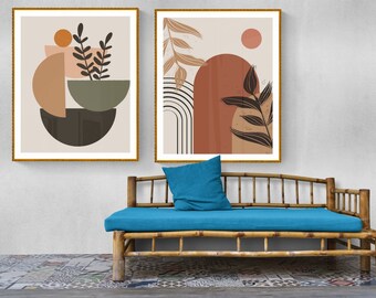 May include: Two framed abstract art prints featuring geometric shapes and foliage in shades of brown, orange, and green, hanging above a blue cushioned bamboo bench.