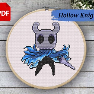 May include: Cross stitch pattern of the Hollow Knight character from the video game Hollow Knight. The character is depicted in a pixelated style, wearing a blue and purple cloak and holding a sword. The pattern is displayed on a white background.