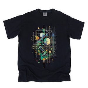 May include: Black t-shirt featuring a colorful geometric design. The graphic includes lines, circles, and shapes in shades of blue, green, yellow, and orange. The design has a modern, abstract aesthetic.