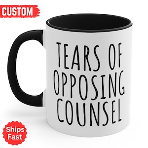 May include: White ceramic mug with a black handle and interior. The mug features the text "TEARS OF OPPOSING COUNSEL" in black, bold letters. The mug is a standard size for coffee or tea.