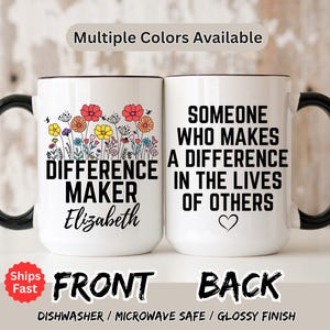 May include: White ceramic mug with a black handle and rim. The front of the mug says "DIFFERENCE MAKER Elizabeth" with a floral design. The back says "SOMEONE WHO MAKES A DIFFERENCE IN THE LIVES OF OTHERS" with a heart.