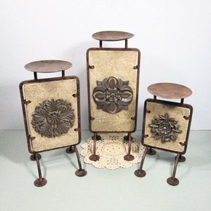 Vintage Pillar Candle Holders with Wrought Iron Pedestal Stands . 3d Rustic Metal Carved Flower Medallions . 3 Size Faux Stone Candle Risers
