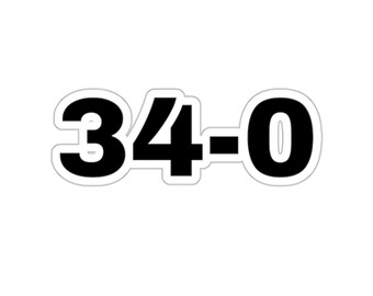 May include: A white sticker with the black numbers and a dash: 34-0. The numbers are in a bold, sans-serif font, and the sticker has a white border.