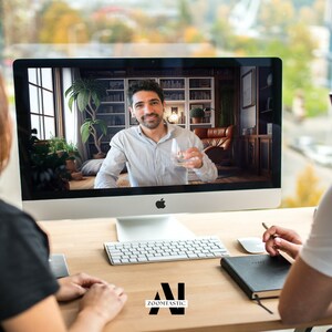 May include: Two people are having a video call on a computer. The person on the screen is holding a glass of water. The people are sitting at a desk with a keyboard, a notebook, and a pen.
