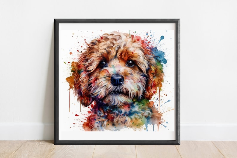 May include: A framed watercolour print of a dog's face. The dog has brown fur and is surrounded by colourful paint splatters in shades of blue, orange, green, and yellow. The artwork is displayed in a black frame.
