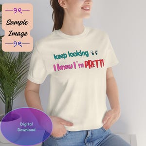May include: Cream-colored t-shirt with the text "keep looking 👀 I know I'm PRETTY" in teal, pink, and red. The shirt is a casual, everyday wear item.