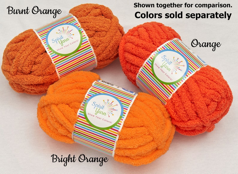 May include: Three skeins of yarn in different shades of orange. The yarn is called "Spirit Yarn" and the colors are "Burnt Orange", "Orange", and "Bright Orange".