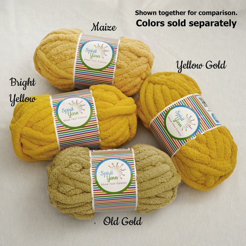 May include: Four skeins of yarn in different shades of yellow. The yarn is labeled "Spirit Yarn" and the colors are "Maize", "Bright Yellow", "Yellow Gold", and "Old Gold".