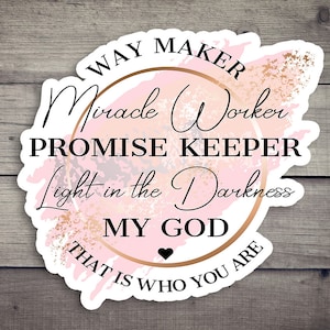 May include: A pink and gold circle sticker with the text "WAY MAKER Miracle Worker PROMISE KEEPER Light in the Darkness MY GOD THAT IS WHO YOU ARE".
