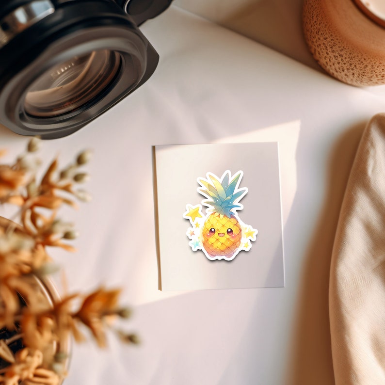 May include: A yellow pineapple with a smiling face and a blue and green crown. The pineapple is surrounded by small yellow stars.