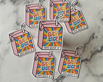 May include: Six pink and white stickers with a rainbow design. Each sticker features a cartoon image of a juice box with the text "Gay Juice" and "100% Queer AF".