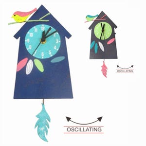 May include: A blue wooden birdhouse clock with a white face and black hands. The clock has a small bird on top and a swinging feather pendulum. The text "OSCILLATING" is written below the pendulum.