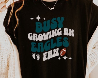 busy growing an eagles fan, eagles maternity tshirt, philadelphia pregnancy announcement shirt, bird gang Maternity, birds fan Loading tee