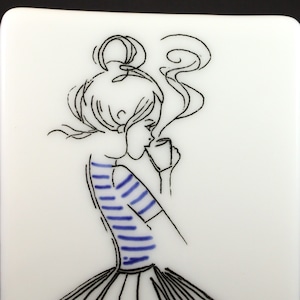 May include: Line drawing of a person with a striped shirt and a long skirt, holding a cup of coffee with steam rising from it.