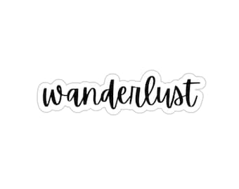 May include: A black and white sticker with the word "wanderlust" written in cursive.