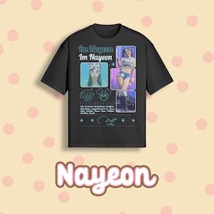 May include: Black t-shirt featuring the text "Im Nayeon" and images of Nayeon. The shirt has a crew neck and short sleeves. The design includes a signature and the word "Nayeon" in a pink and white font.