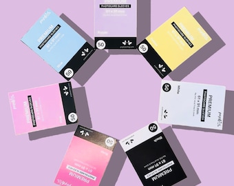 May include: A set of six packs of photocard sleeves in different colors: purple, blue, pink, white, black, and brown. Each pack contains 50 sleeves and measures 61 x 91 mm.