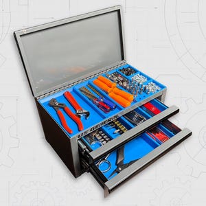 May include: A silver metal toolbox with three drawers, open to reveal an assortment of tools. The drawers are lined with blue trays, holding wrenches, screwdrivers, and other hardware. The toolbox is labeled "US GENERAL".