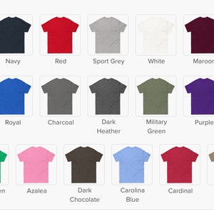 May include: A selection of t-shirts in various colors, including black, navy, red, and gray. The image displays a grid of shirts with color names like "Natural," "Ash," and "Carolina Blue" below each shirt. The shirts are displayed on a white background.
