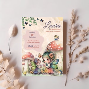 May include: A whimsical invitation card with a watercolor illustration of two fairies with wings, flowers, and mushrooms. The text reads "Laura is turning xxxx! Please join us to celebrate!"  Saturday, 18 September, 11am @ Laura's House, 13 Lucky Lane Hometown, RSVP by Sept 10 to Samantha 0412345678.