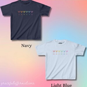 Navy and light blue version of graphic tees with rainbow martinis