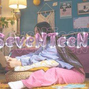 May include: A young person is sitting on a bed with a pink and purple blanket, writing on a piece of paper. The word "Seventeen" is written in a glittery, pink font over the image.