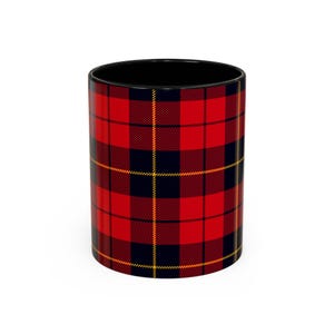 May include: A cylindrical mug with a black interior and a red, black, and yellow plaid pattern on the exterior. The mug is a classic design, suitable for hot or cold beverages.
