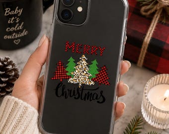 May include: A clear phone case featuring a graphic design with the text MERRY in red plaid, the word Christmas in black script, and four stylized Christmas trees in red plaid, green, and leopard print patterns on a black background.