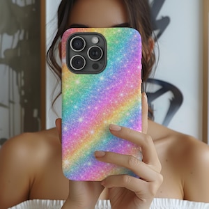 May include: A colorful phone case with a rainbow glitter design. The case has a gradient of colors, including pink, yellow, green, and blue. The phone case has a camera module with three lenses.