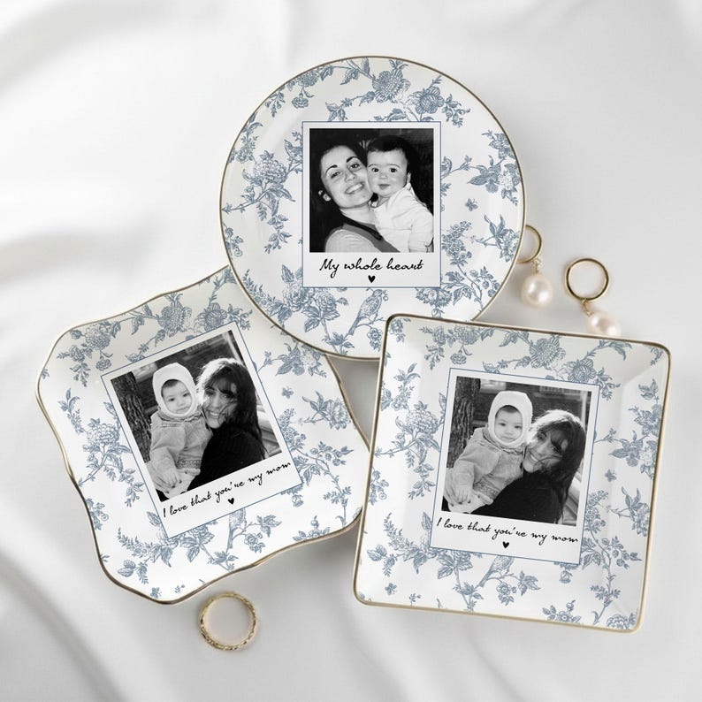 May include: Three decorative plates with a blue floral pattern and gold trim. Each plate holds a black and white photo with text. One says "My whole heart" and the others say "I love that you're my mom."
