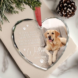 May include: A heart-shaped glass bauble with a photo of a golden retriever dog. The bauble has the text "IF LOVE ALONE COULD HAVE KEPT YOU HERE YOU WOULD HAVE LIVED FOREVER. Willow 2016-2024" on it.