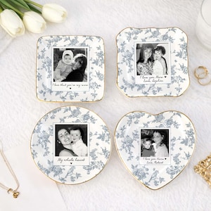 May include: Four decorative dishes with floral patterns and gold rims. Each dish features a black and white photo with handwritten text. The shapes include a square, a scalloped square, a circle, and a heart. The text includes phrases like "I love you Mom" and "My whole heart."