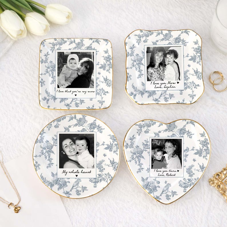 May include: Four decorative dishes with floral patterns and gold rims. Each dish features a black and white photo with handwritten text. The shapes include a square, a scalloped square, a circle, and a heart. The text includes phrases like "I love you Mom" and "My whole heart."