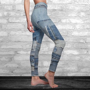 May include: Blue denim-print leggings with a patchwork design. The leggings feature various shades of blue and gray, mimicking the look of distressed denim jeans. The leggings are form-fitting and reach the ankles.