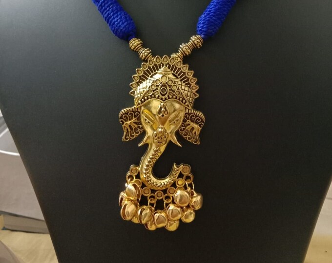 Oxidised golden ganesha traditional pendant and matching earrings.