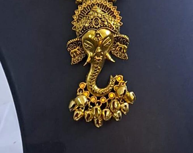 Orange thread necklace with Golden oxidised traditional pendant
